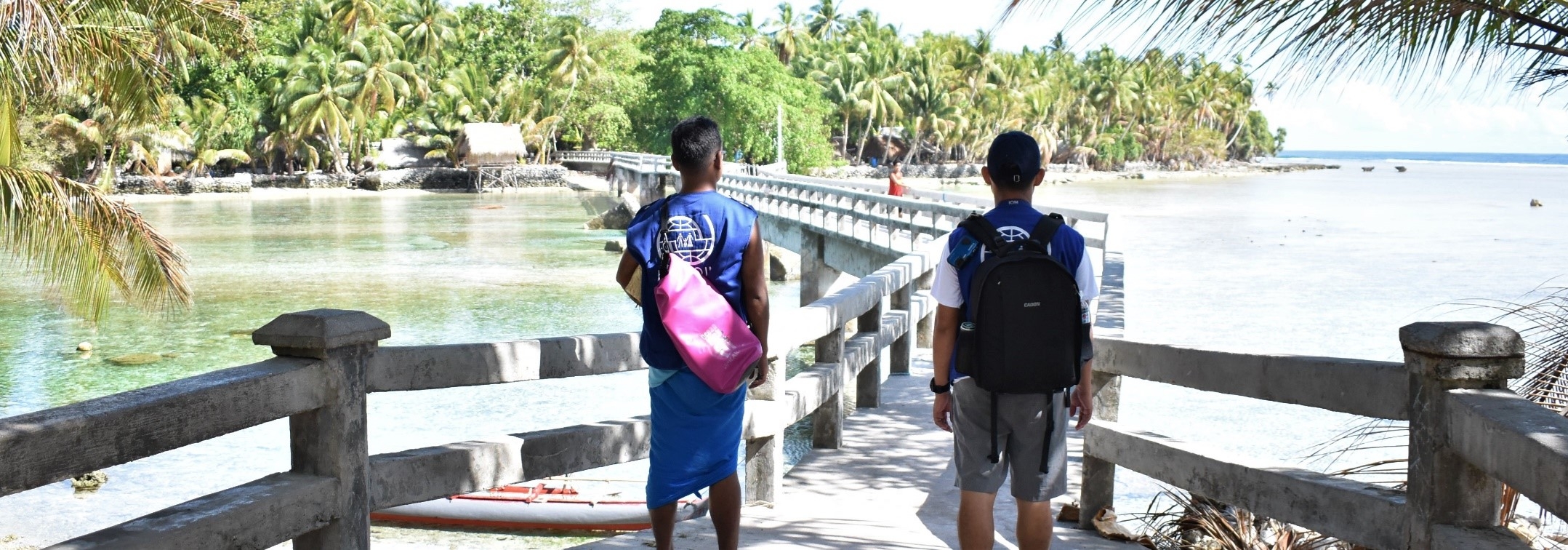 IOM crossing a bridge in Kapingamarangi Atoll, Pohnpei, FSM